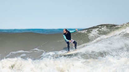 Adam J. Harrington surfing
